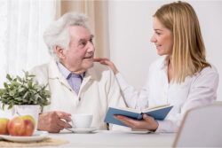 caregiver and elder reading book